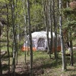Tent camper at Aspen Acres Campground in Rye Colorado