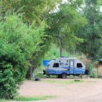 An RV on a campsite at Lone Duck Campground in Cascade Colorado in the Waldo Canyon