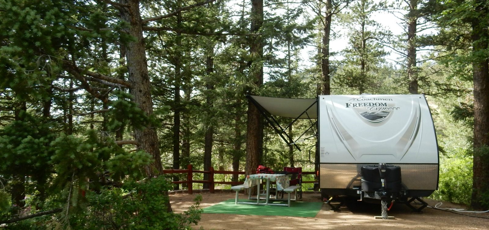 An RV site at Jellystone Park™ of Estes in Estes Park Colorado