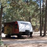 An RV in a site at Colorado Heights Camping Resort in Monument Colorado between Denver and the Springs