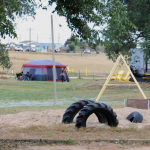 Falcon Meadow RV Campground near Colorado Springs - play area with tent camper in background