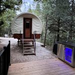 Covered wagon glamping option at Cutty's Hayden Creek Resort in the Rocky Mountains of Colorado