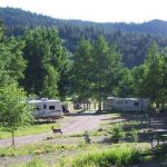 Choose RV sites tucked into the mountain or close to the rec hall at Aspen Acres Campground in Rye Colorado