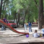 Playground under the trees at Chalk Creek RV Park & Campground near Buena Vista Colorado