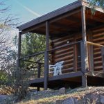 One of our rustic pioneer cabins, with two queen beds with linens, Sweetwater River Ranch in Texas Creek, CO
